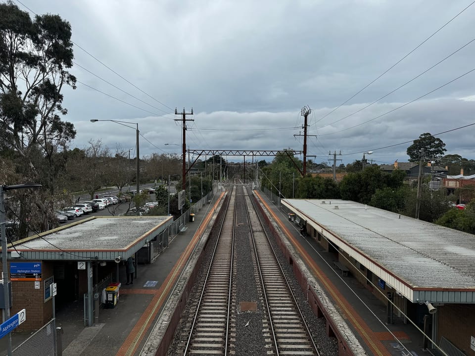 Photo looking over railway from footbridge at Alphington Railway Station
